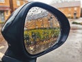 Rain drops on the wing mirror of a car Royalty Free Stock Photo