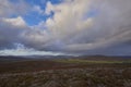 Rain falling across the Angus Glens looking north as the clouds sweep in over the peaks of the Cairngorm National Park.