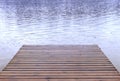 Rain falling on a boat launch dock and lake, spring summer weather and camping travel background Royalty Free Stock Photo
