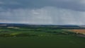 Rain falling in the distance from above. atmospheric phenomenon