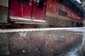 Rain falling on the station platform in front of a train Royalty Free Stock Photo