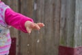 rain falls on the child hand,Hands with water splash,the rain drips on the hand Royalty Free Stock Photo