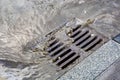 Rain flowing into a storm water sewer system Royalty Free Stock Photo