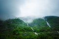 Rain forest in a middle of India. Beautiful green forest with rain. Waterfalls and amazing view from the road.