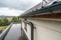 Rain gutter of roof with downpipe Royalty Free Stock Photo
