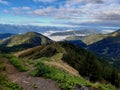 after the rain in the high mountains. the sun breaks the clouds and fogs