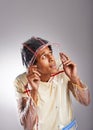 Rain is just confetti galling from the sky. Studio shot of a young man wearing a fashionable raincoat.