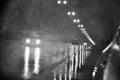 Rain at night on the road with street lights in the dark street Royalty Free Stock Photo