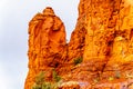 Rain pouring down on the geological formations of the red sandstone buttes surrounding the Chapel of the Holy Cross at Sedona