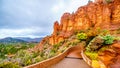 Rain pouring down on the geological formations of the red sandstone buttes surrounding the Chapel of the Holy Cross at Sedona Royalty Free Stock Photo