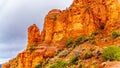 Rain pouring down on the geological formations of the red sandstone buttes surrounding the Chapel of the Holy Cross at Sedona Royalty Free Stock Photo