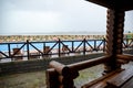 Rain pours down the pool and everything around the recreation center with wooden houses on a summer day Royalty Free Stock Photo