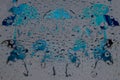 Rain. Raindrops fall down against the gray background with blue umbrella silhouettes and their reflections.