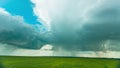 Rain Rainy Clouds Above Countryside Rural Field Landscape With Young Green Wheat Sprouts In Spring Summer Cloudy Day Royalty Free Stock Photo