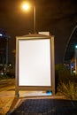 Rain or shine, your message is clear. a blank light box on a bus stop.