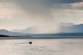 Rain shower over Marsh Lake Yukon Territory Canda