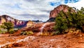 After rain showers, streams and puddles forming at Courthouse Butte, a famous red rock between the Village of Oak Creek and Sedona