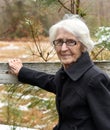 Rain Sleet or Snowy Elderly Woman Takes Her Walk