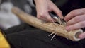 Rain sticks. Art. Creating old wooden instrument that simulates sound of rain. Craftsman creates wooden instrument