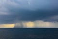 Rain & storms over the ocean, on a grey cloud day at sea Royalty Free Stock Photo