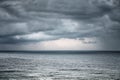 Rain and stormy cloud over sea