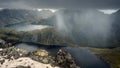 rain and thunderclouds in the mountains of norway before the storm. dramatic landscape of lakes, peaks and sky in the Lofoten Isl Royalty Free Stock Photo