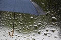 Rain on an Umbrella. Black Umbrella in the Rain Against the Background of Water Drops. Rainy Weather Concept