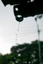 Rain water dropping from the drain pipe also known as drain spout during rain monsoon season. Used selective focus Royalty Free Stock Photo