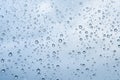 Rain water drops on blue Royalty Free Stock Photo