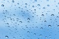 Rain water drops blue glass Royalty Free Stock Photo