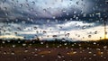 Rain water drops cover on the glass with blur background Royalty Free Stock Photo