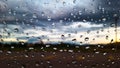 Rain water drops cover on the glass with blur background Royalty Free Stock Photo