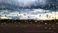 Rain water drops cover on the glass with blur background Royalty Free Stock Photo