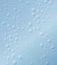 Rain water drops on transparent glass with gradient wavy sky blue to white gradient background Royalty Free Stock Photo