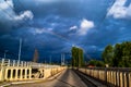 A rainbow over the cloudy bridge