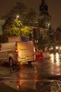 The rain and wet roads in london in night with street lights and traffic