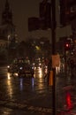 The rain and wet roads in london in night with street lights and vehicles