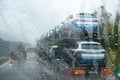 Rain-wet windscreen blocks the view of the road / Dangerous blurry driving car in the rainy weather Royalty Free Stock Photo