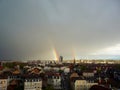 Rainbow above Mulhouse: Europe\'s City of Beautiful Cloudy Skies, Tower Silhouettes, and a Heavy Rain Royalty Free Stock Photo