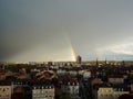 Rainbow above Mulhouse: Europe\'s City of Beautiful Cloudy Skies, Tower Silhouettes, and a Heavy Rain Royalty Free Stock Photo