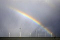 Rainbow above a offshore windpark, Holland