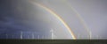 Rainbow above a offshore windpark, Holland Royalty Free Stock Photo