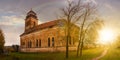 Abandoned catholic church on hill at sunset