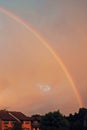 Rainbow above the village in the forest Royalty Free Stock Photo