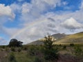 Rainbow against mountain background