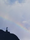 A rainbow appears behind the magnificent statue of Jesus Christ in Tana Toraja, Indonesia