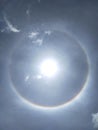 Rainbow around the sun.blue sky. Royalty Free Stock Photo
