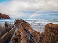 Rainbow on the Itzurun Beach in Zumaia, Basque Country, Spain Royalty Free Stock Photo