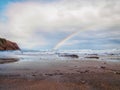 Rainbow on the Itzurun Beach in Zumaia, Basque Country, Spain Royalty Free Stock Photo