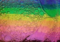 Rainbow background with bubbles, texture of water and oil drops Royalty Free Stock Photo